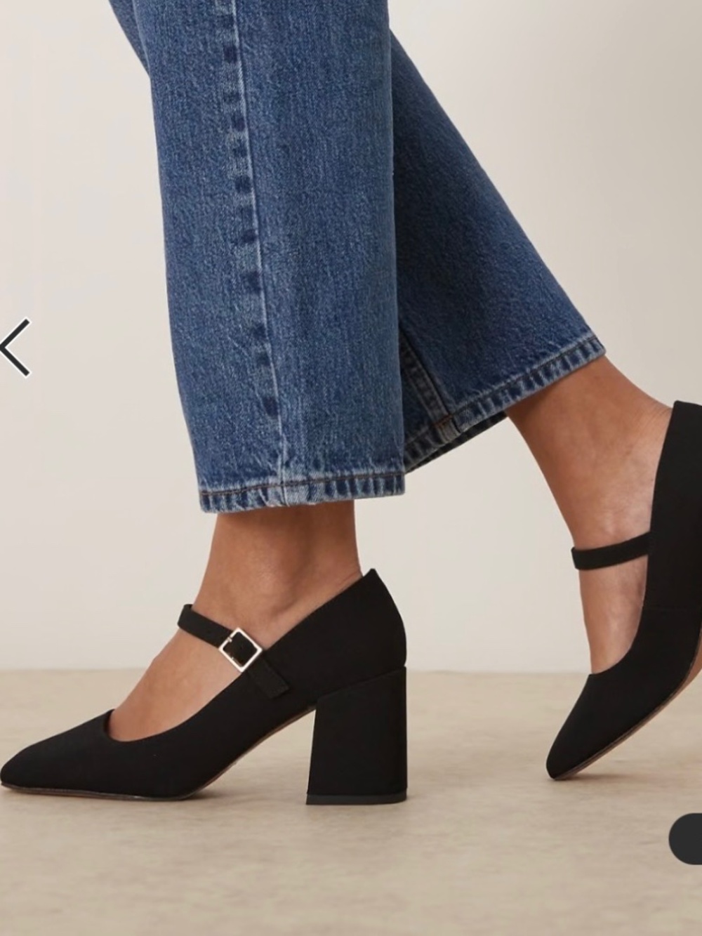 Mary Jane black mid-block heeled shoes.